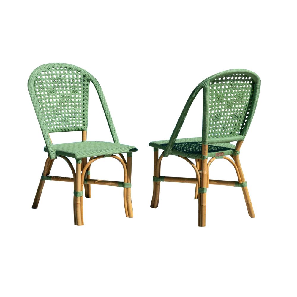 Two green wicker chairs on a white background