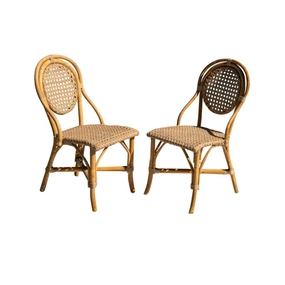 Two wicker chairs on a white background