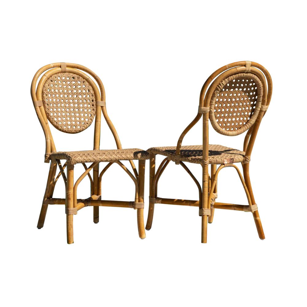Two wicker chairs on a white background
