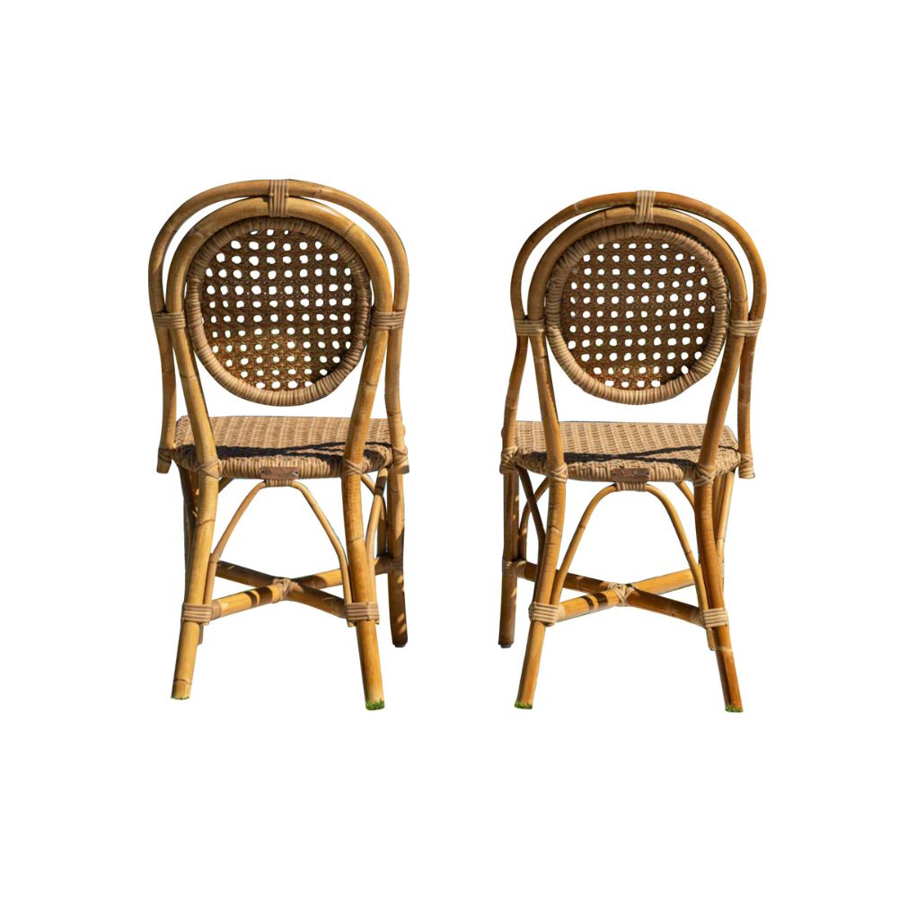 Two wicker chairs on a white background