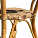 Close-up of a wicker chair with a brand tag on a white background