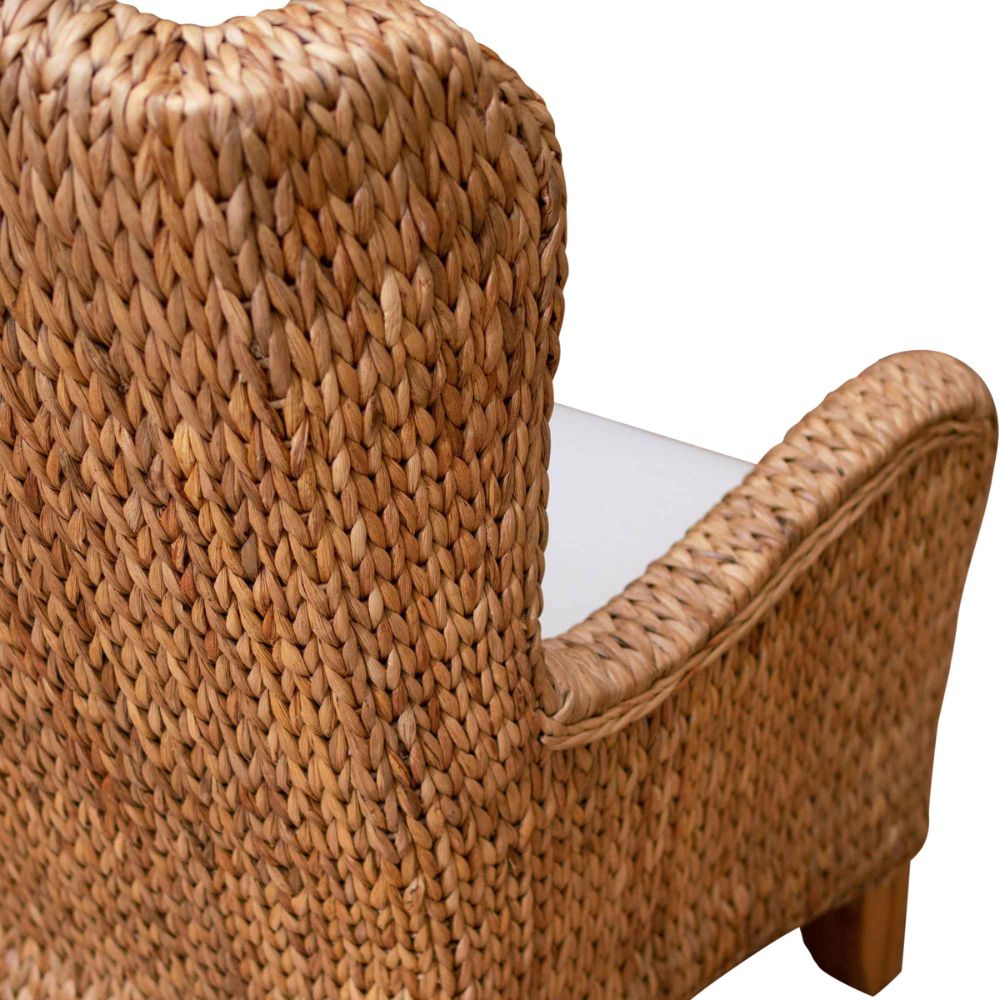 Close-up of a woven wicker chair arm on a white background