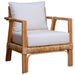 Wicker armchair with white cushions on a white background