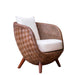 Woven chair with white cushions on a white background