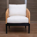 Chair with white cushion and wooden frame against a wooden panel background