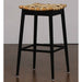 Bar stool with woven seat on a plain background