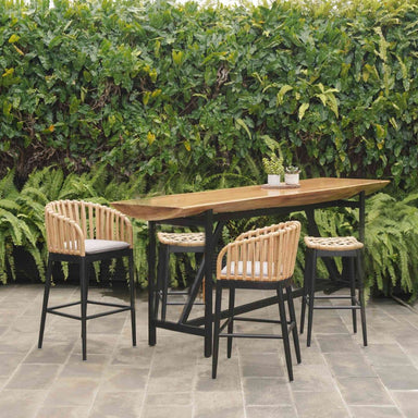 Outdoor dining set with a wooden table and chairs against a green hedge.