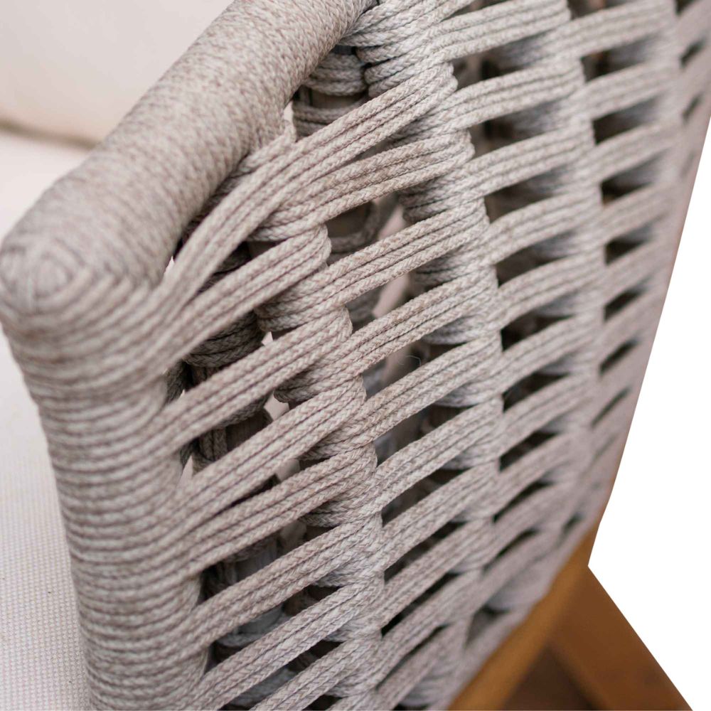 Close-up of a woven chair with a neutral background