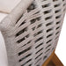 Close-up of a woven chair with a neutral background