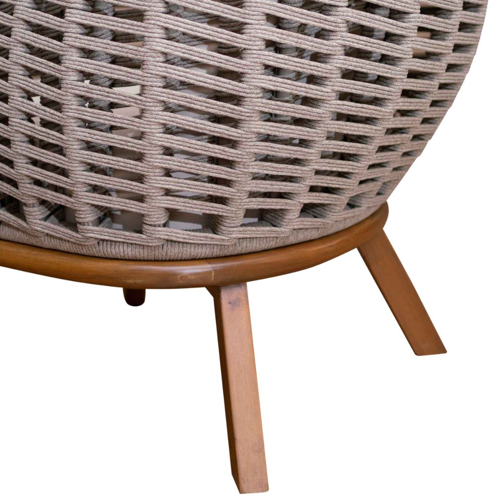 Wicker chair with wooden legs on a white background