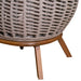 Wicker chair with wooden legs on a white background