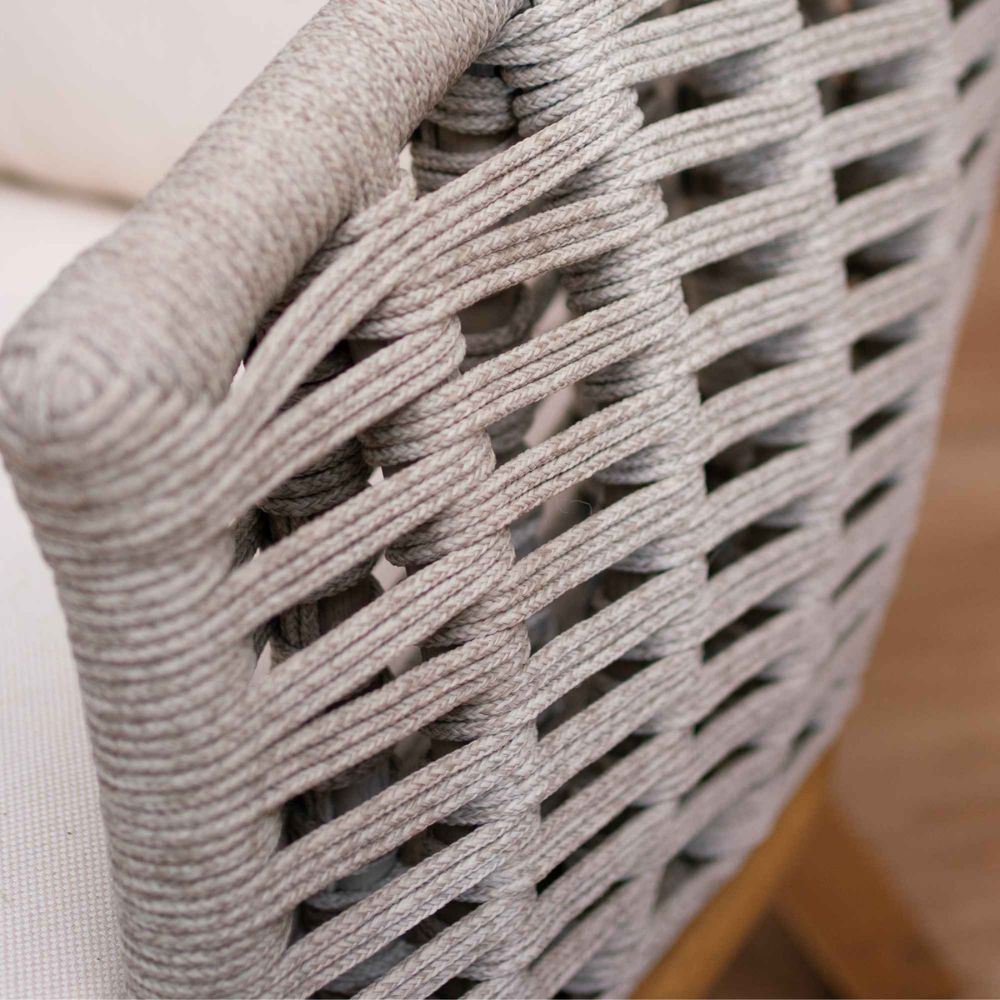 Close-up of a woven chair seat with a neutral background