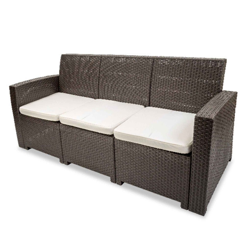 Brown wicker outdoor sofa with white cushions on a white background