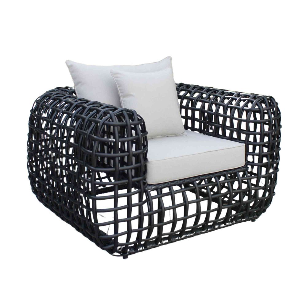 Black woven armchair with white cushions on a white background