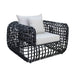 Black woven armchair with white cushions on a white background