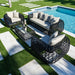 Outdoor patio furniture set with cushions by a pool