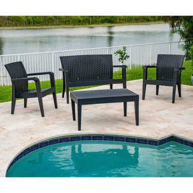 Black outdoor furniture set with chairs and a table by a poolside.
