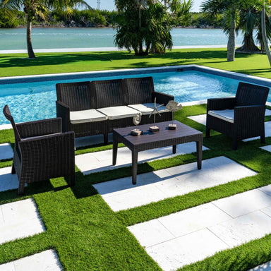 Outdoor patio set with furniture by a poolside