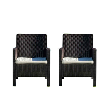 Two black wicker chairs with blue cushions on a white background