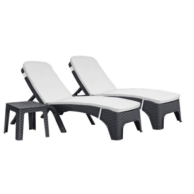 Two black wicker lounge chairs with white cushions on a white background