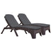 Two brown wicker lounge chairs with gray cushions on a white background