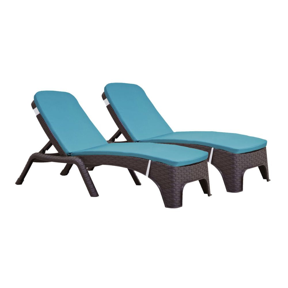 Two blue cushioned lounge chairs with wicker frames on a white background