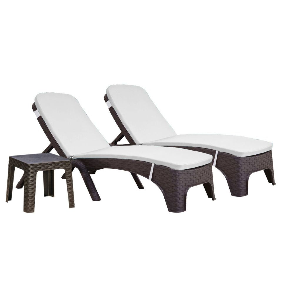 Two wicker sun loungers with white cushions on a white background