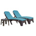Two wicker lounge chairs with blue cushions on a white background