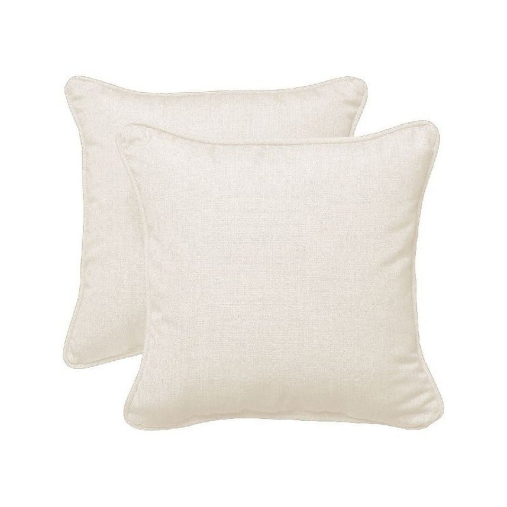 Two beige pillows on a white background